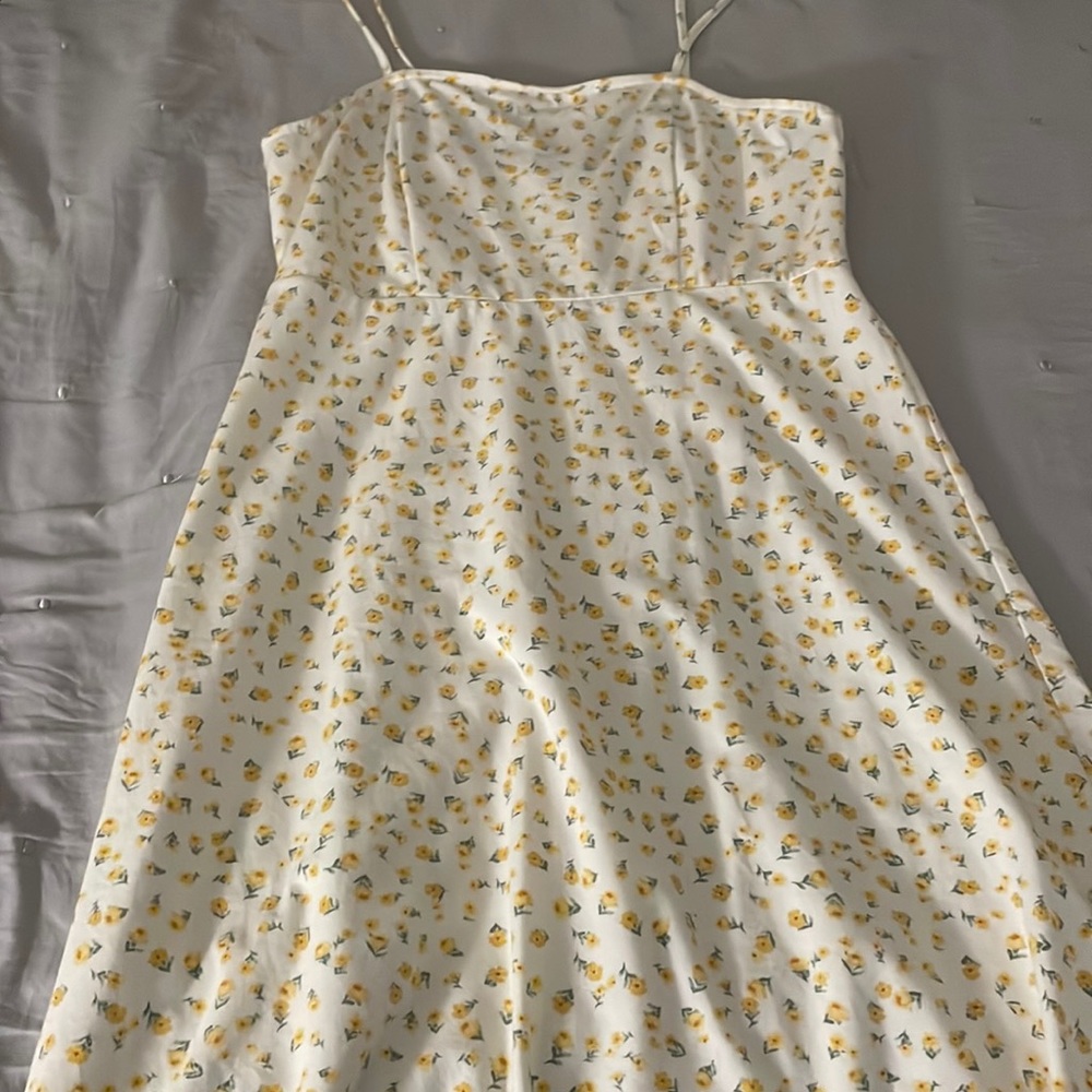 It’s a long floral dress that has yellow flowers on it in the size medium